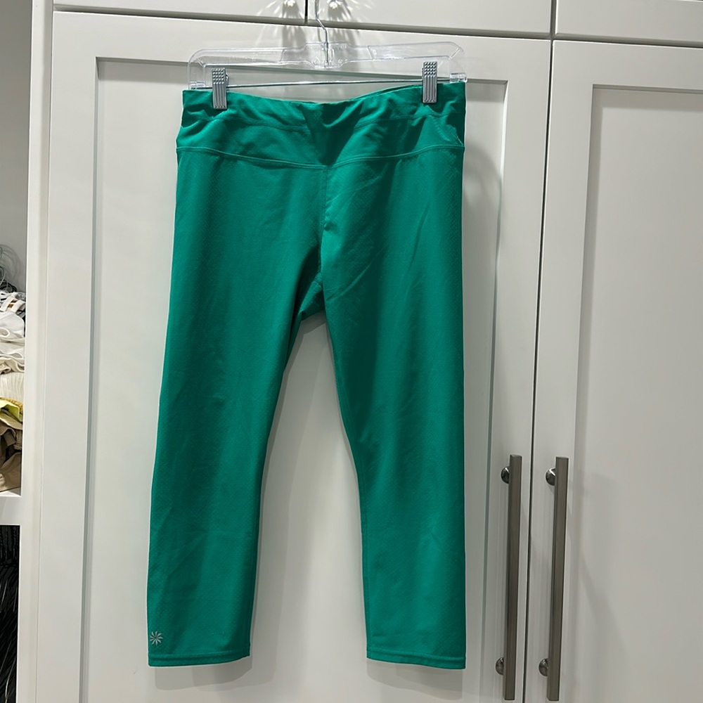 Green workout pants by the brand Athleta size medium